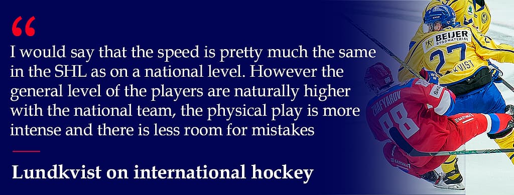 Hockey players competing for the puck during international match