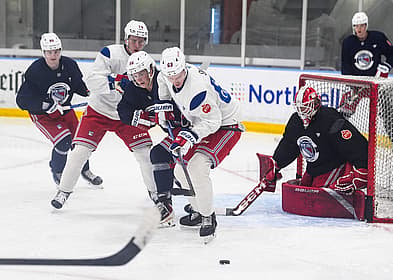 NY Rangers prospect, and first round draft pick, Alberts Šmits (63) works against Felix Farhammar (56) during a prospect