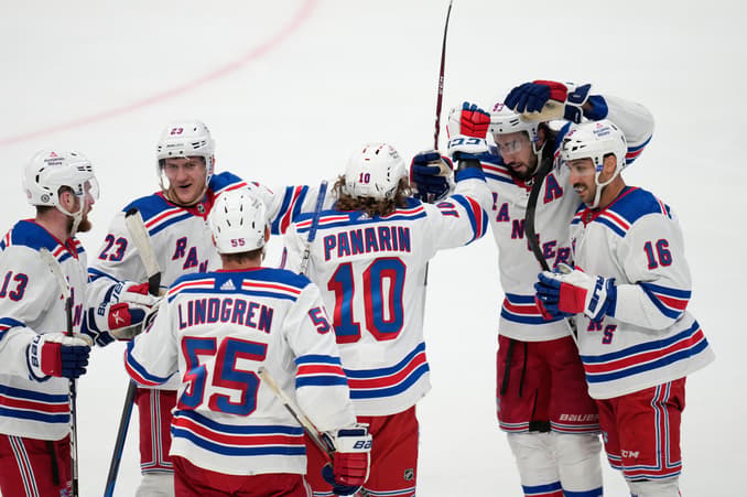 Rangers players celebrate Panarin's goal during game against Arizona