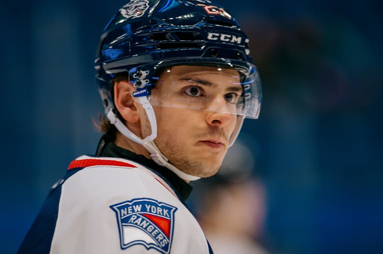 New York Rangers player in CCM helmet during game