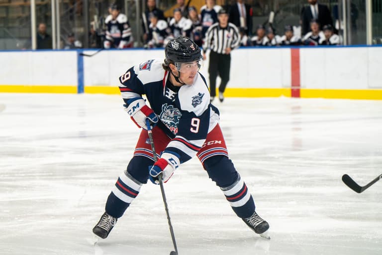 Brett Berard in Rangers uniform during preseason game at home rink
