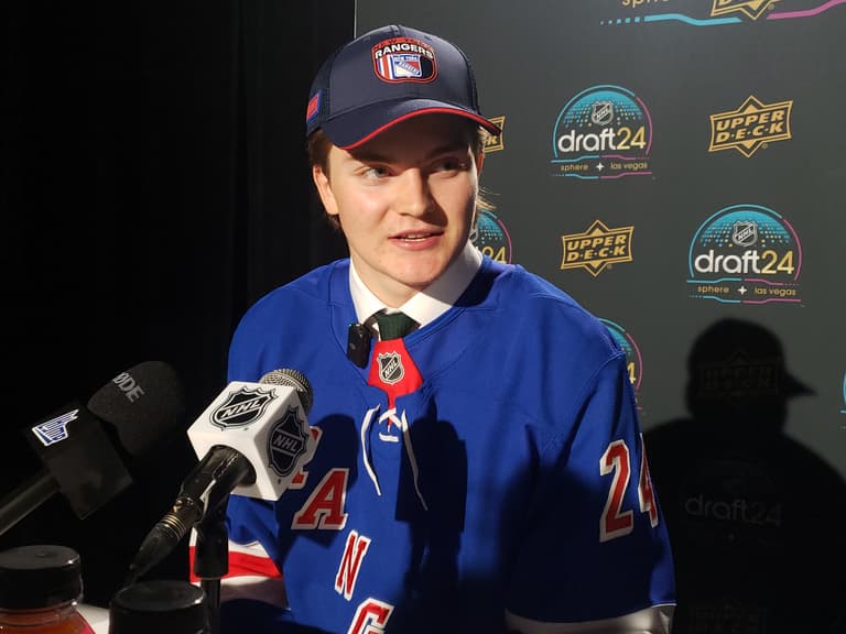 New York Rangers draft pick in blue jersey at NHL Draft 2024 media event