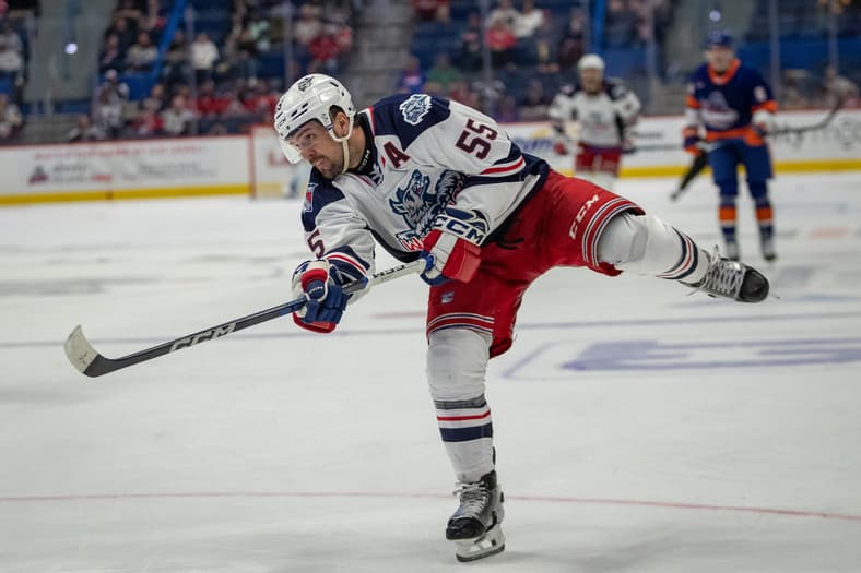 Alex Belzile shooting the puck during Hartford Wolf Pack game