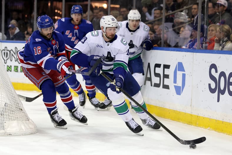 NHL: Vancouver Canucks at New York Rangers -- defenseman Marcus Pettersson carries the puck behind the net.