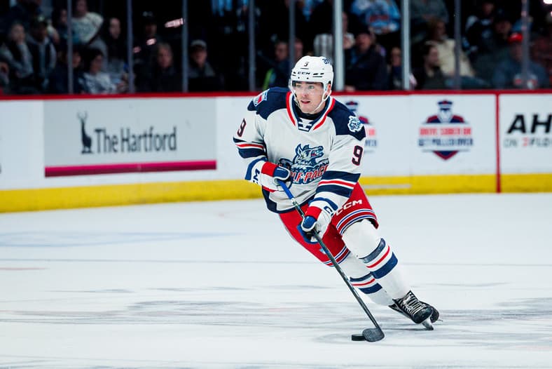 Brody Lamb skating with the puck during a Hartford Wolf Pack game