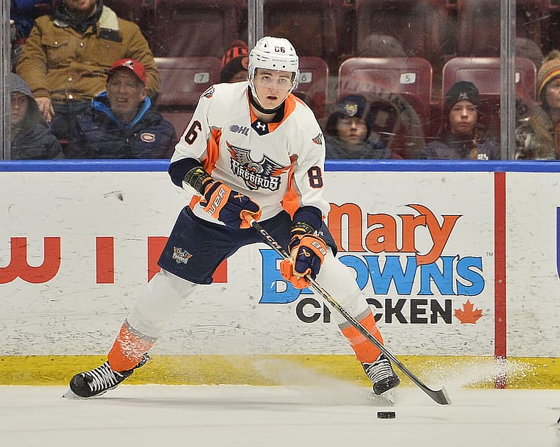 Player #8 in Firebirds uniform skating with puck during OHL game